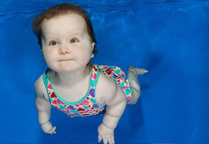 baby girl swimming