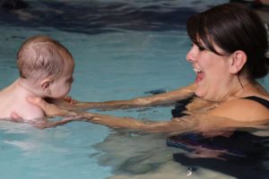 baby swims with mum at swimkidz